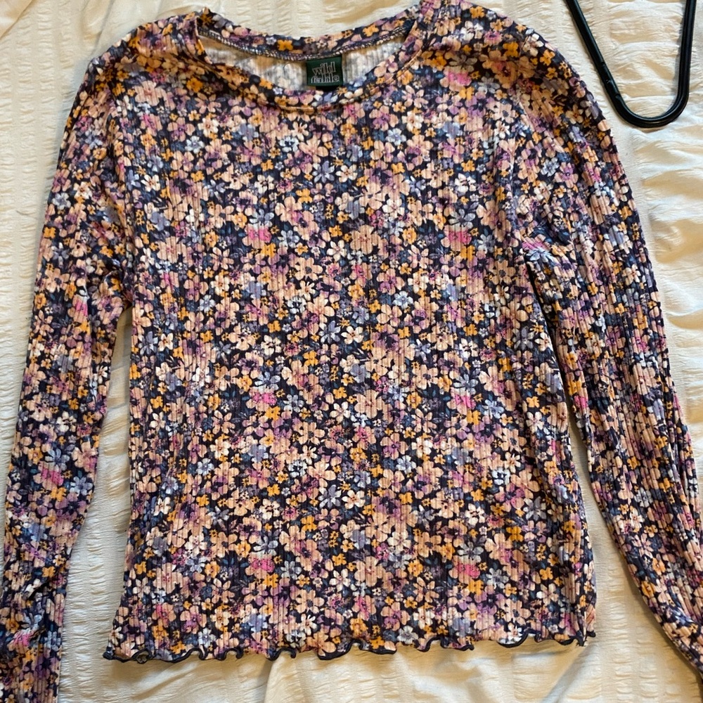 Flowery long sleeve tight top.